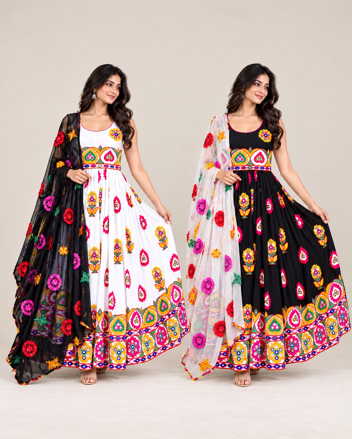 Two women modeling matching embroidered Anarkali-style gowns with dupattas. The left model wears a white gown with black and multicolor embroidery, and the right model wears a black gown with white and multicolor embroidery.