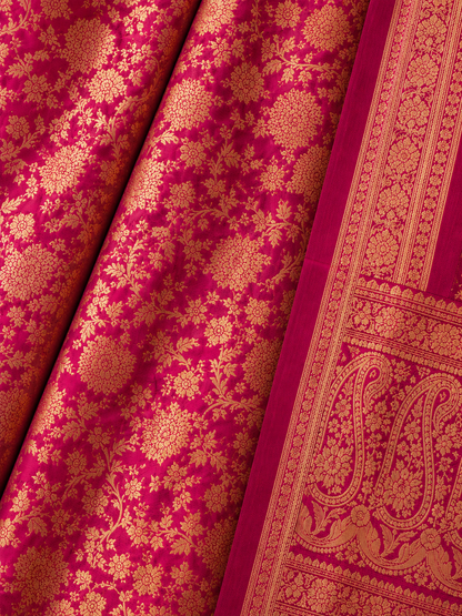 Close-up of Fuchsia Pink Banarasi Silk Saree with Gold Floral Zari Weaving and Green Paisley Border
