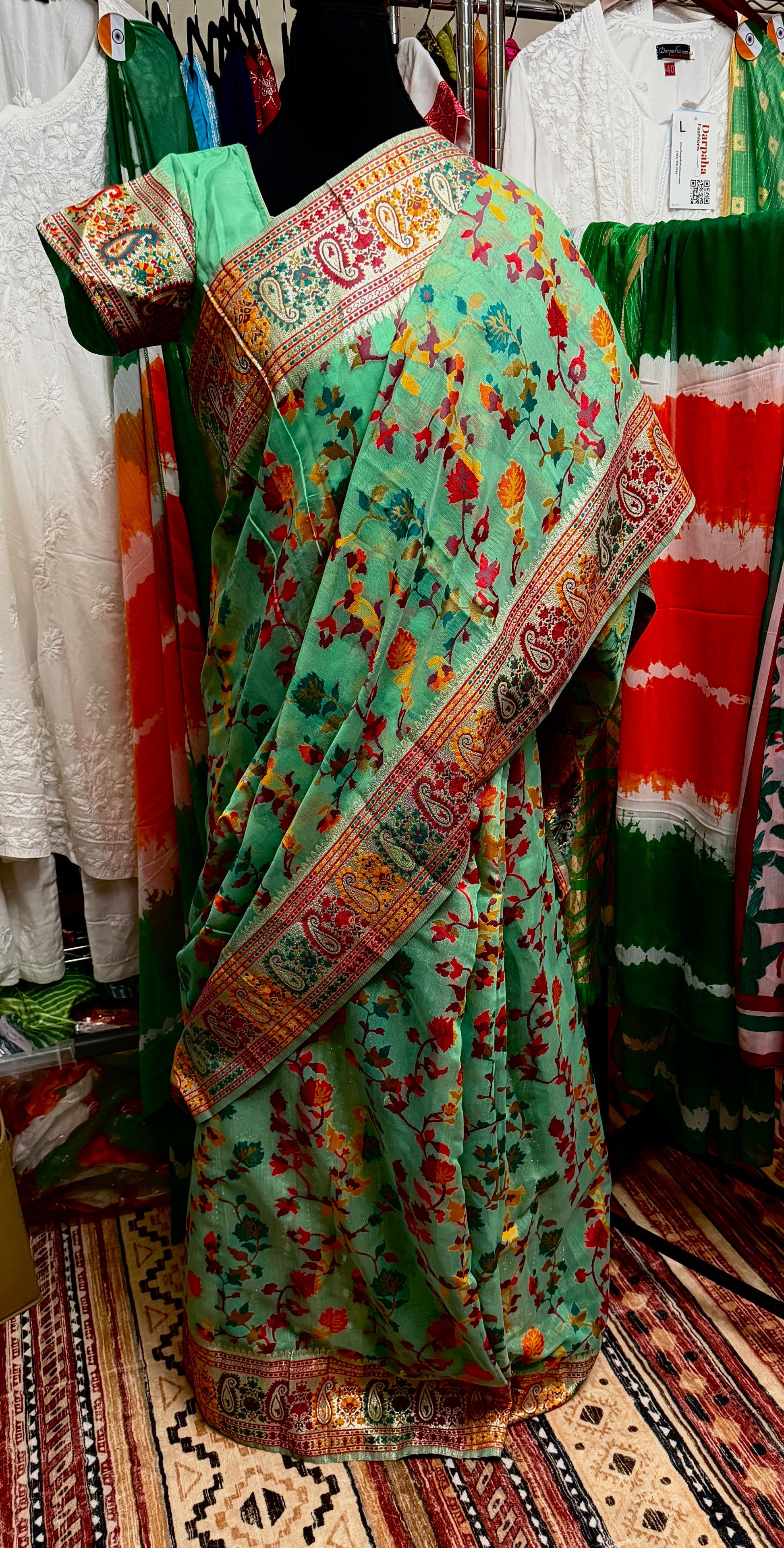 Full-length view of a model wearing the Green Chanderi silk jacquard saree with its coordinated stitched blouse.