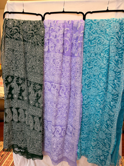 Women's pure georgette embroidered saree collection featuring six elegant colors—green, blue, purple, maroon, dark green, and peach—with intricate white floral embroidery and paisley motifs.