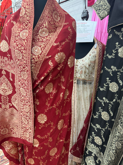 Maroon Dola silk saree color variant featuring rich gold zari floral weaving and traditional border.