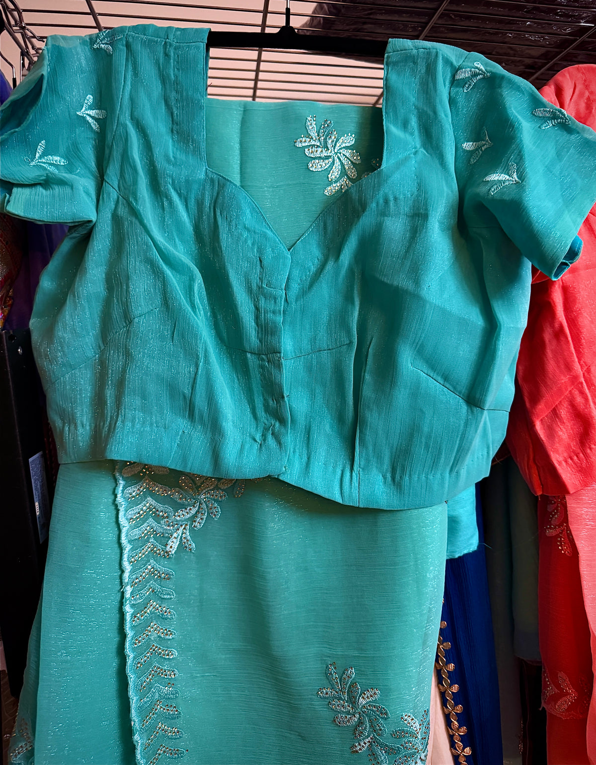 Close-up of Teal shimmer tissue chiffon fabric showing its subtle shine and texture