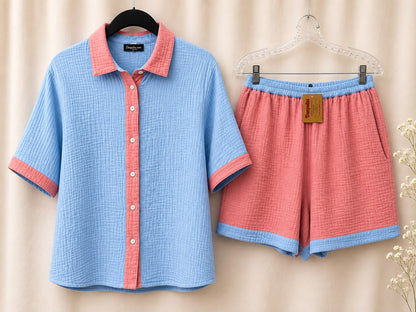 Blue cotton pajama shirt with pink trim and matching pink shorts