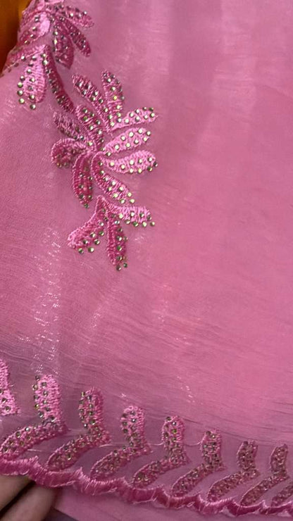 Close-up of blush pink tissue chiffon saree showing intricate floral embroidery