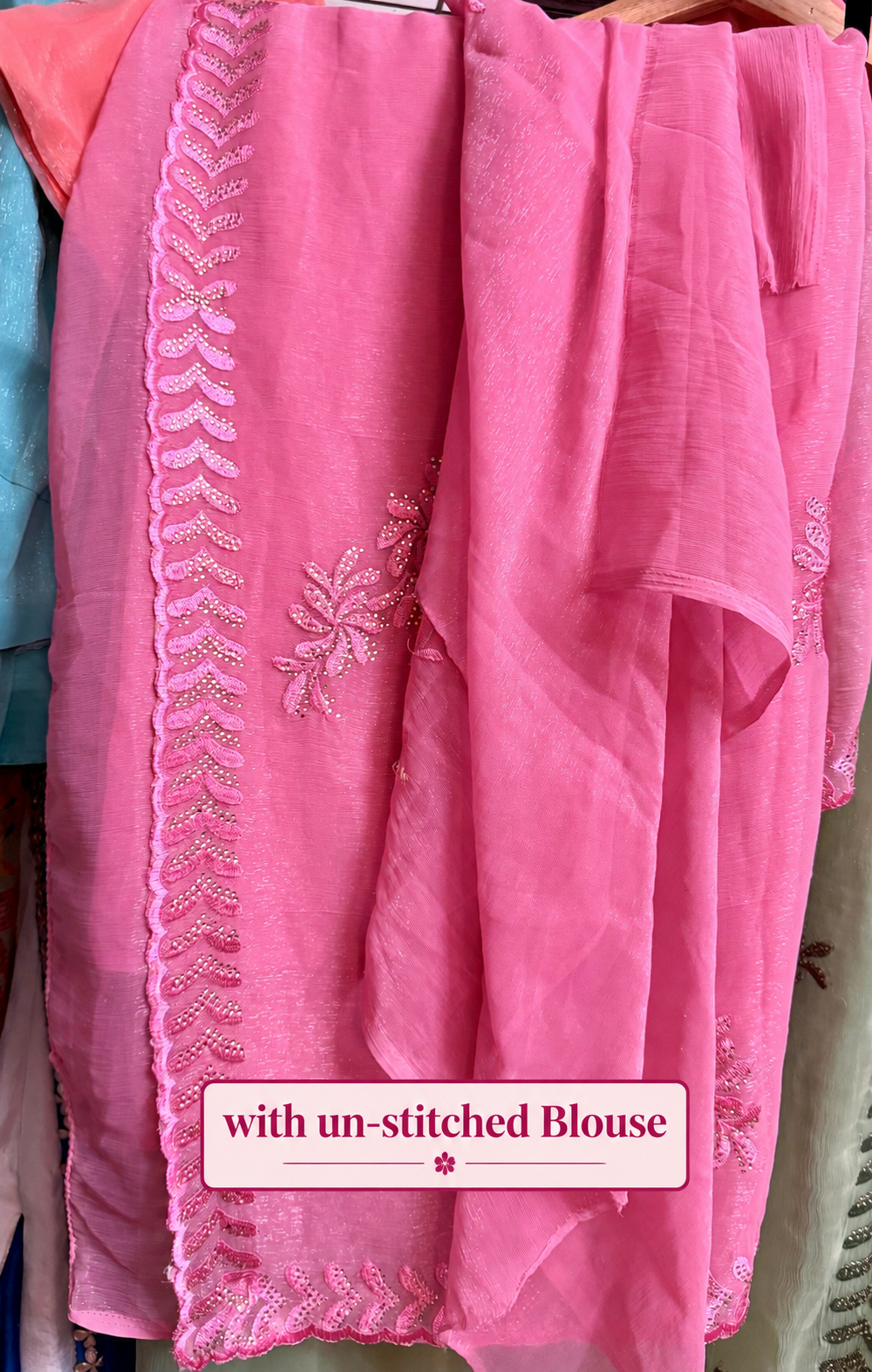 Blush pink shimmer tissue chiffon saree with embroidered floral motifs, detailed border and un-stitched blouse