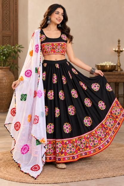 Front view of the black chaniya choli set with sleeveless embroidered blouse and full-flare lehenga