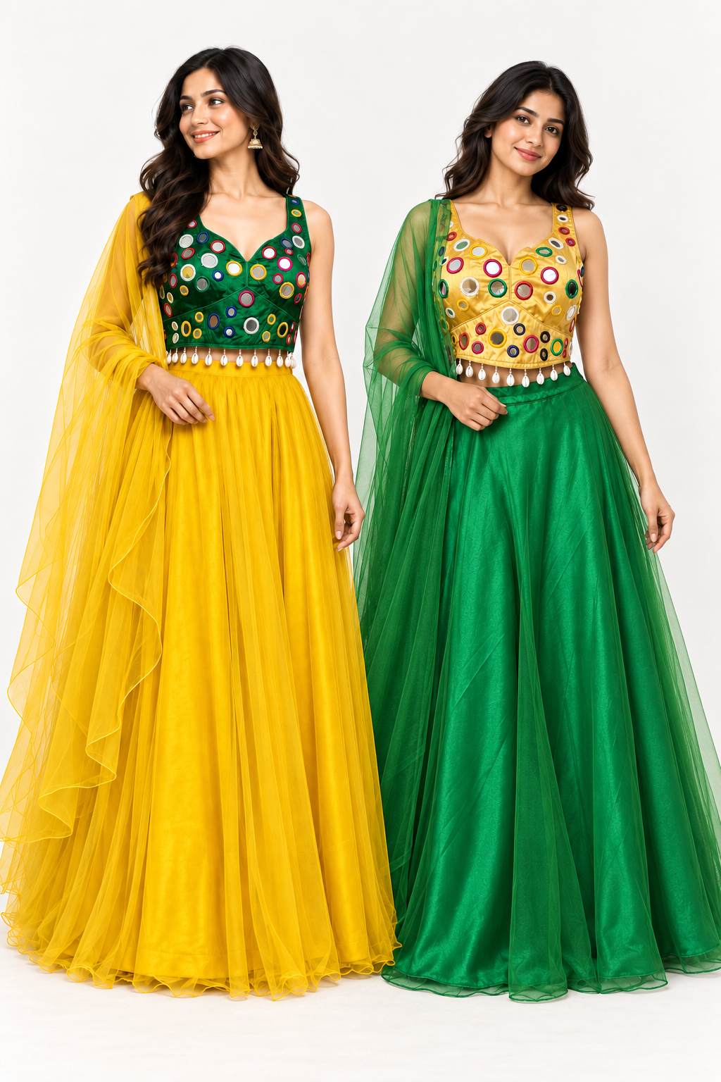 Two women modeling matching traditional Indian lehenga choli gowns side by side. The woman on the left wears a yellow gown with a green embellished bodice and a sheer yellow dupatta.