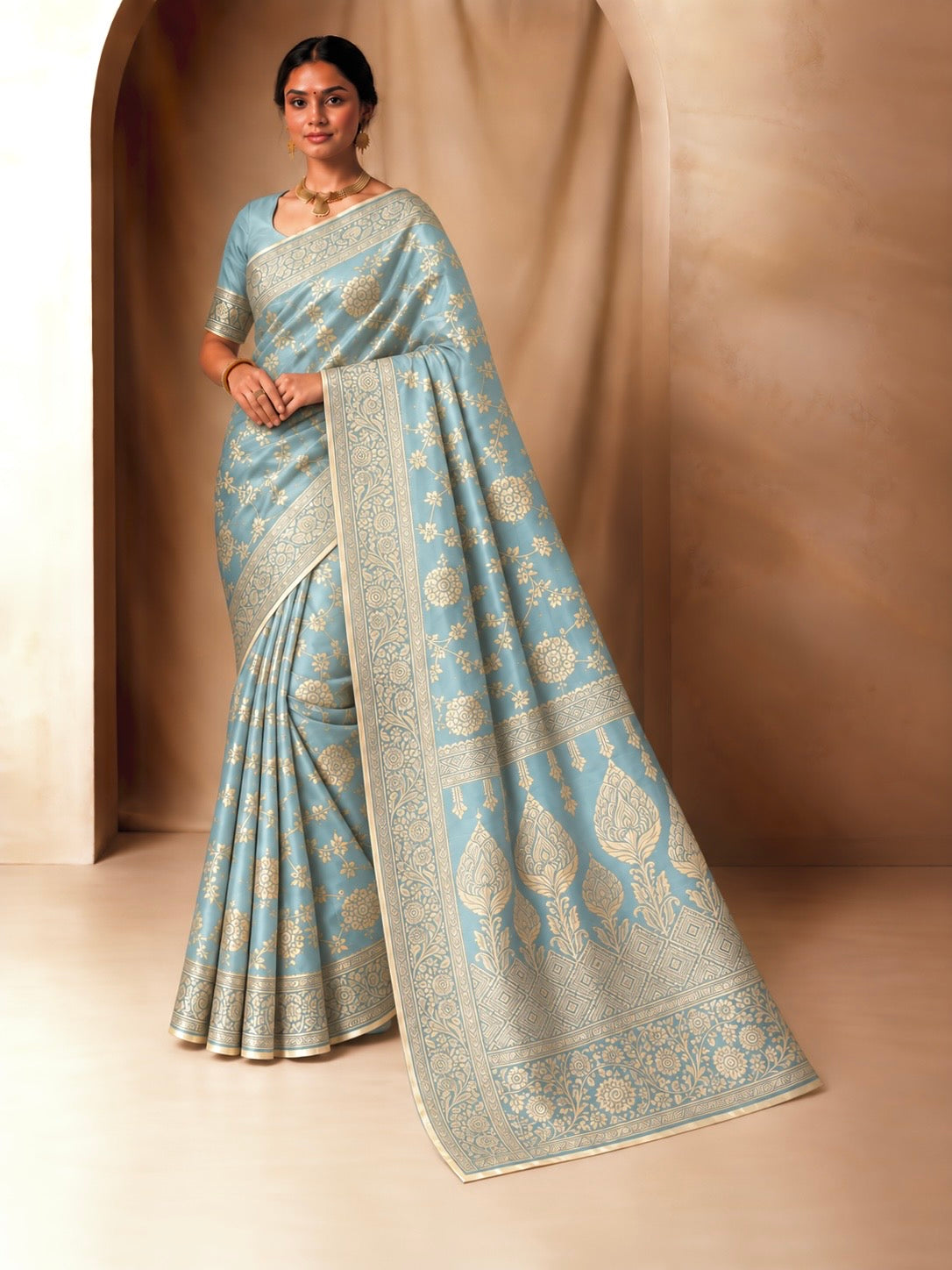 Soft icy aqua jacquard saree with bright gold floral zari border and detailed pallu