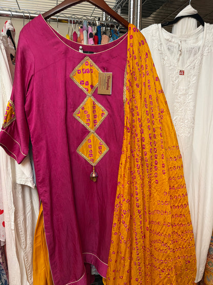 Magenta Art Silk Patiala salwar suit paired with a mustard Banarasi dupatta, showcasing traditional Punjabi styling.