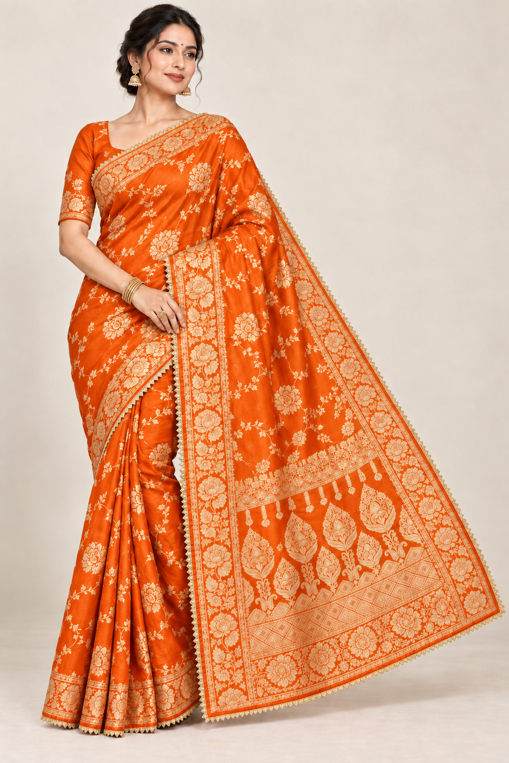 Orange jacquard zari saree with gold floral border and traditional woven pallu
