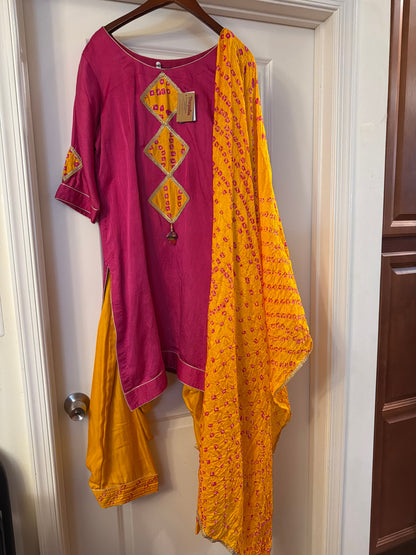 Close-up of the magenta Art Silk Patiala salwar suit and mustard Banarasi dupatta detailing.