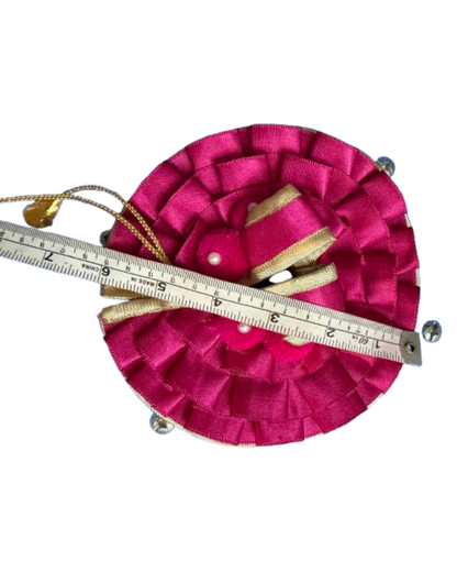 Pink and magenta Laddu Gopal poshak shown with measuring tape for size reference