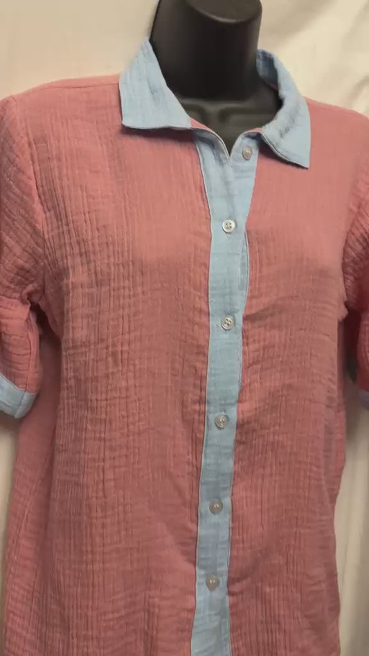 Video of Muslin cotton pajama set with powder blue shorts and a button-front shirt.