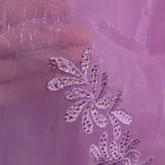 Close-up of lavender tissue chiffon saree showing detailed floral embroidery