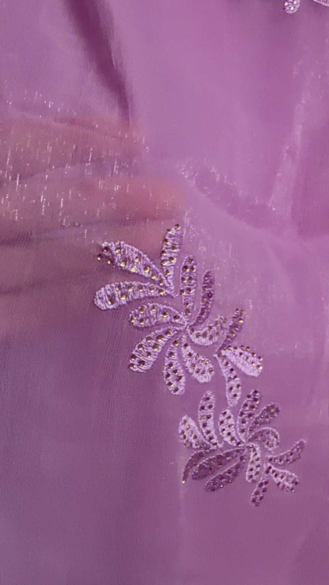 Close-up of lavender tissue chiffon saree showing detailed floral embroidery