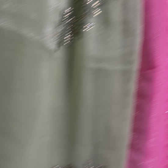 Close-up of a pistachio-green, lavender, and blush-pink shimmer tissue chiffon saree showing its soft sheen and fabric texture