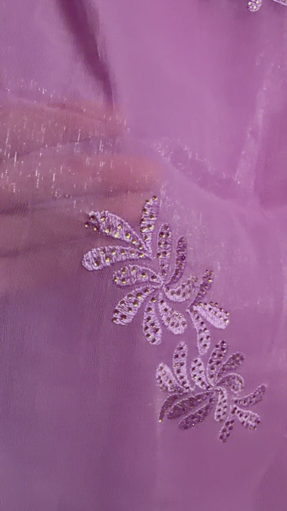 Close-up of lavender shimmer tissue chiffon saree fabric showing its soft sheen