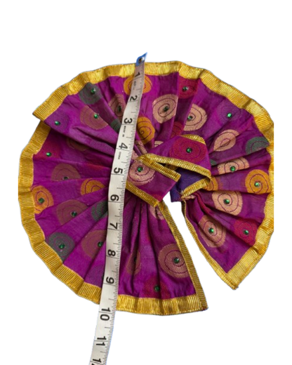 Purple and gold Laddu Gopal poshak shown with measuring tape for size reference