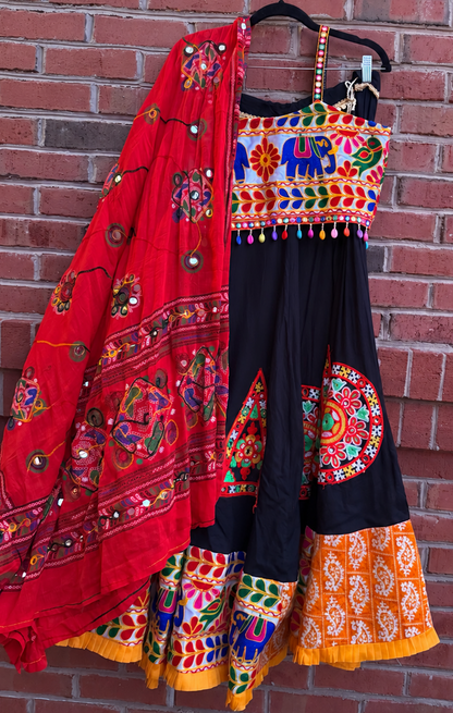  Original product photo of the black chaniya choli with multicolor embroidery, satin blouse, and red dupatta.
