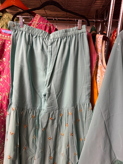 Teal Georgette embroidered Sharara suit set displayed on a hanger