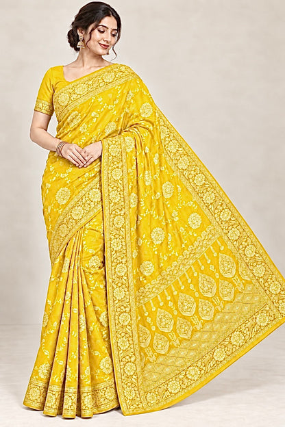 Yellow jacquard zari saree with gold floral border and traditional woven pallu