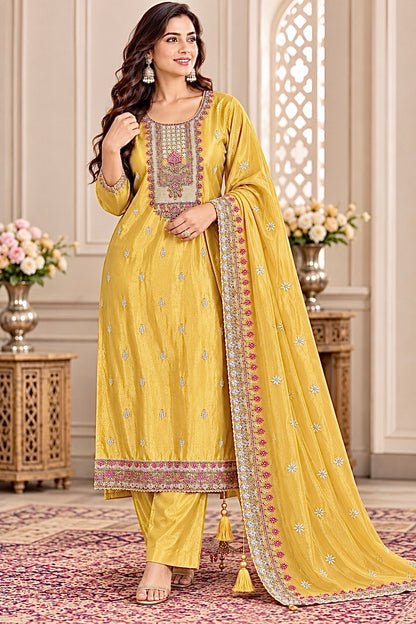 Close-up of embroidered and handwork neckline on golden yellow Tussar silk suit